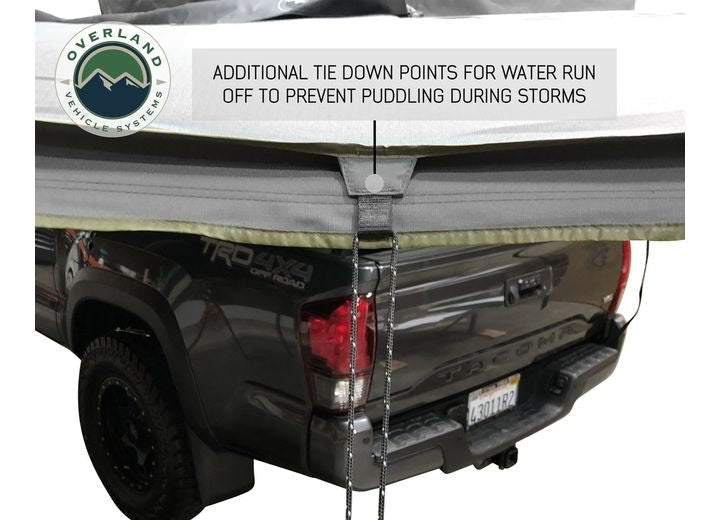 270-Degree Nomadic Awning with Dark Gray Canopy and Black Driver Side Transit Cover