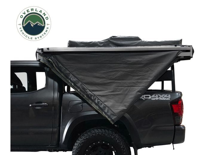270-Degree Nomadic Awning with Dark Gray Canopy and Black Driver Side Transit Cover
