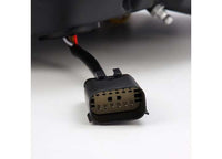 Close-up of a black electrical connector with multiple pins, attached to a black cable against a white background. The connector appears to be part of an electronic device, possibly for AlphaRex USA's RAM LUXX LED Tail Lights Alpha-Black with Sequential Signal Lights - 19-22 Model, or other automotive components with enhanced visibility.