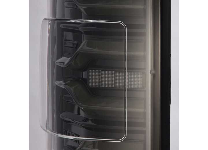 Close-up image of a sophisticated and sleek black fan blade system encased within a transparent protective cover, demonstrating precise engineering and modern design elements, much like how the AlphaRex USA RAM LUXX LED Tail Lights Alpha-Black with Sequential Signal Lights for 19-22 models enhance visibility.