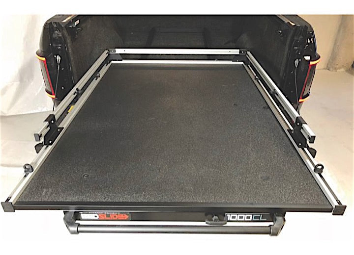 The BEDSLIDE 1000 CLASSIC 78IN X 48IN from Bedslide is a black sliding extension platform designed to fit in your truck bed, making loading and unloading cargo effortless while enhancing your truck bed's cargo management capabilities.