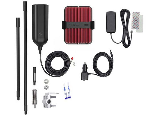 The components of the weBoost Drive Reach OTR Signal Booster Kit are laid out. Items include an antenna, metal rods, mount hardware, cables, connectors, and a red rectangular device. The kit is neatly arranged to enhance your cellular coverage with all parts necessary for installation.