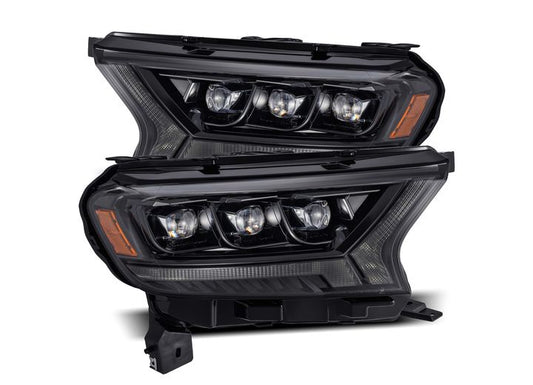 The 19-22 RANGER NOVA-Series LED Projector Headlights from AlphaRex USA feature a black housing and clear lens, with multiple LED bulbs arranged in a distinctive plank style pattern. The sharp design elements provide a stylish and aggressive appearance, enhanced by activation lights and sequential signal functionality.