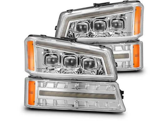 AlphaRex USA presents the LED Projector Headlights for 03-06 Chevy Silverado Avalanche, a modern and stylish upgrade featuring multiple LED bulbs and clear lens covers. These headlights come in a chrome finish housing designed specifically for the Chevrolet Silverado, with orange side markers and rectangular daytime running lights positioned below the main lights. Their angular design adds a sleek, contemporary look to your vehicle.