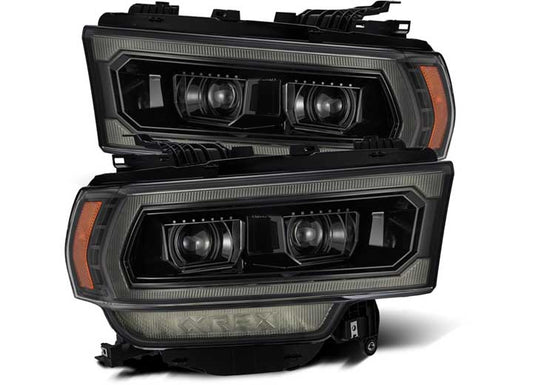 A set of AlphaRex USA 19-22 RAM 2500 LUXX-Series LED projector headlights, boasting a sleek black and grey design with dual projector lenses and integrated amber side markers. Displayed one above the other, these headlights emphasize their angular, aggressive styling.