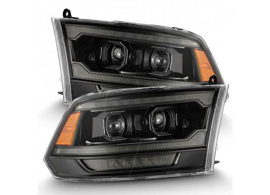 Introducing the AlphaRex USA 09-18 RAM 2500 LED Projector Headlights with ACT Light, Sequential Signal, and DRL Alpha. These headlights feature a modern rectangular design with dual round bulbs encased in sleek black housing. The clear lens showcases intricate internal detailing, and the edges are equipped with amber-colored turn signal indicators for added visibility.