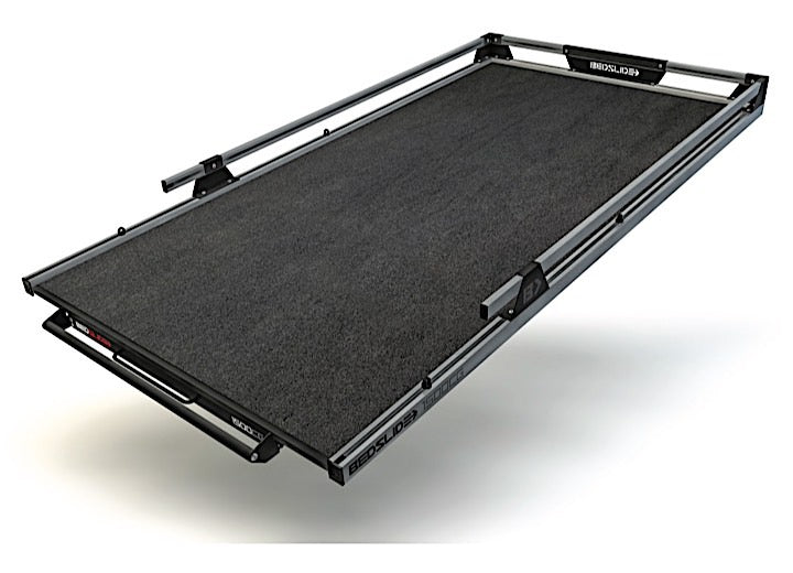 A BEDSLIDE CONTRACTOR 65INX48IN sliding truck bed tray in black and gray, featuring metal guardrails on the sides. The heavy-duty tray extends outward to reveal its black textured surface and robust construction. The brand name "Bedslide" is prominently displayed on the side rails, with a capacity of up to 1500 lbs.