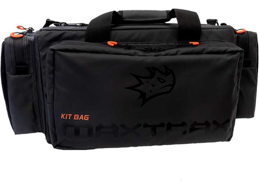 This black MAXTRAX RECOVERY KIT BAG features an orange zipper pull on the main compartment and side pockets. The front pocket displays an embossed logo, with "Kit Bag" printed in orange and "MAXTRAX" in black. This versatile design also includes top carrying handles.