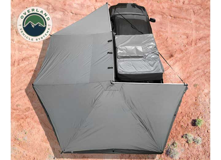 270-Degree Nomadic Awning with Dark Gray Canopy and Black Driver Side Transit Cover