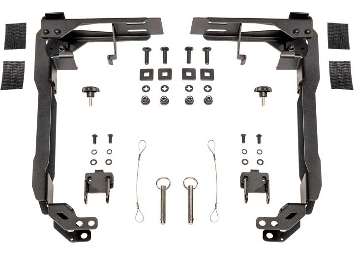 Image of various black metal components and hardware pieces spread out symmetrically. The items include brackets, screws, bolts, nuts, washers, pins, and straps from the Pelican RFMT2 Cargo Case Roof Mount Kit Black Gen2 - Durable, Easy Installation, Perfect for Adventure Gear. These are likely part of an assembly or mounting kit for a mechanical or automotive application.