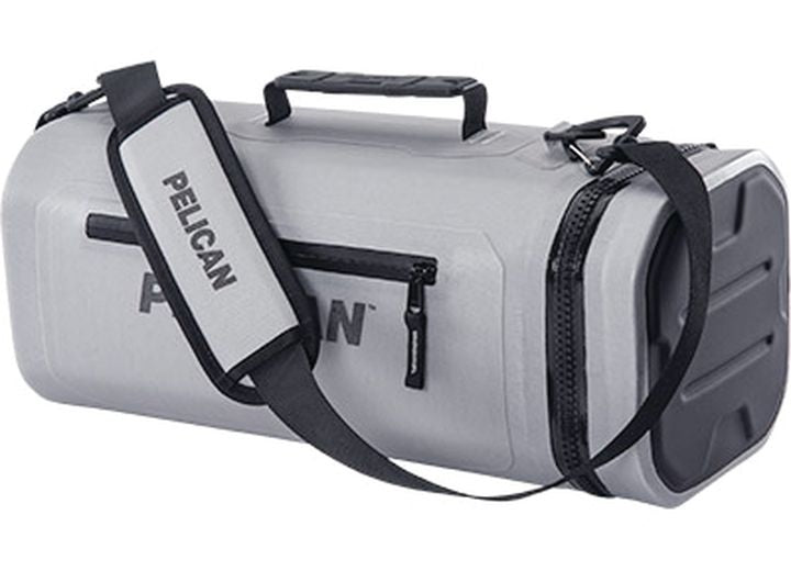 The Light Grey Pelican Cooler Sling – a durable, adjustable carrying solution for outdoor adventures by Pelican – features black zippers, a black adjustable shoulder strap with "Pelican" text, and a top handle. Additional black accents adorn the ends of this robust cooler sling.