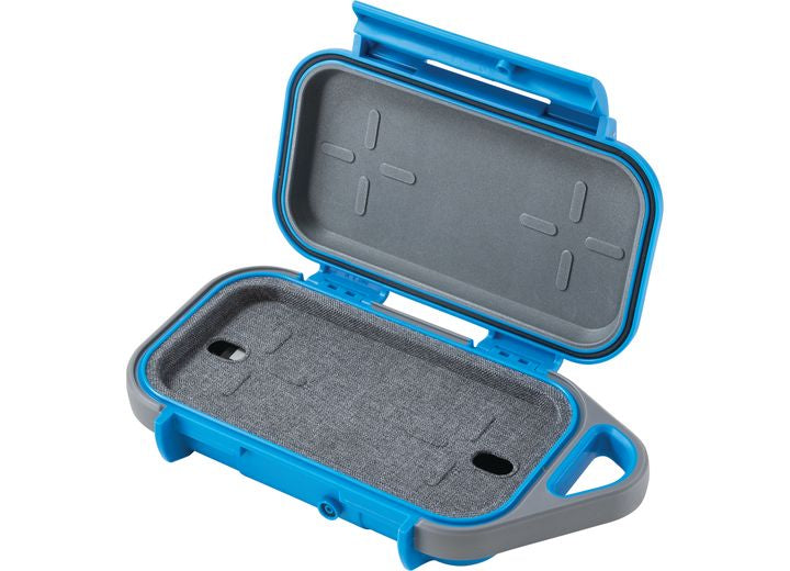 An open Pelican Go Case G40 in durable Surf Blue/Grey with foam padding is shown. The interior features slots to securely hold items and provides waterproof protection. Made from impact-resistant materials, this case includes a hinge on one side and a handle-like structure on the other.