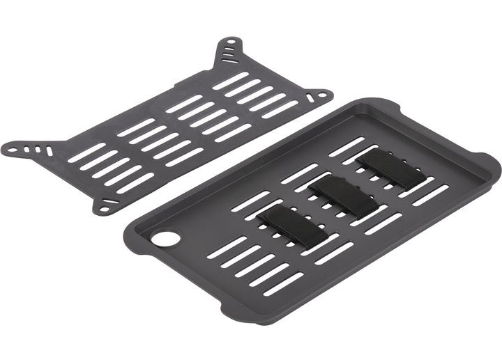 A rectangular cable management tray in black, featuring a durable design with multiple slots for organizing cables. The matching cover includes similar slotted patterns for ventilation and access, and it resembles the design of a Pelican Ruck Case R60 by Pelican. The cover also has four mounting holes at the corners.